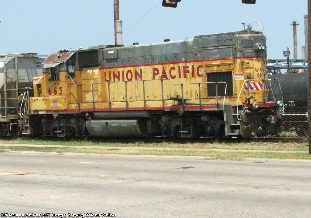 Remote control UP unit works yards next to petro plants along Shreveport's Jewella Avenue, near the Libby Glass plant.